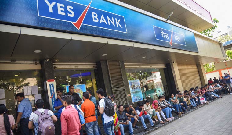 Account holders queue up outside Yes Bank to withdraw money, in Mumbai | PTI