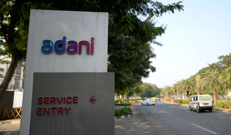 A signage near the entrance of Adani Corporate House in Ahmedabad | AP