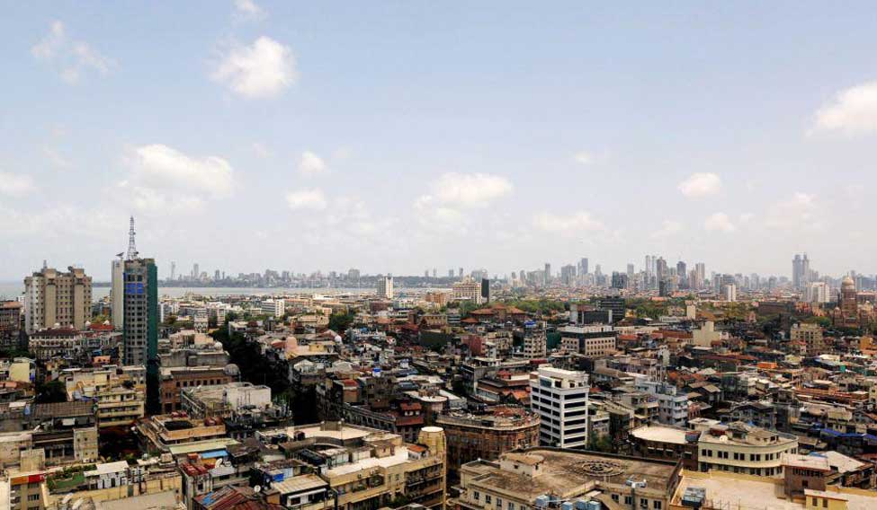 Scattered clouds are seen over Mumbai's skyline, India, June 2, 2015. India cut this year's forecast for monsoon rains to 88 percent of the long-term average, Earth Sciences Minister Harsh Vardhan said on Tuesday, raising fears of a drought in the country where nearly half of farmland lacks irrigation facilities. REUTERS/Danish Siddiqui