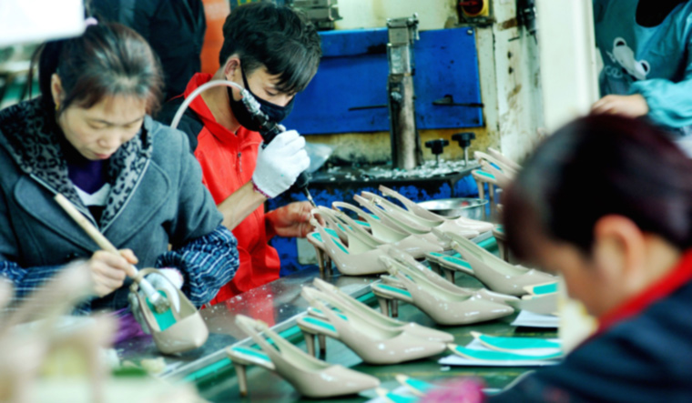 china-workers-factory-shoe-women-export-econimy-afp