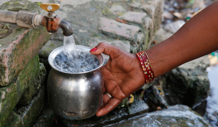 woman-fills-drinking-water-from-a-public-tap-allahabad-ap
