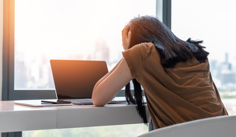 woman-stressful-depressed-anxiety-disorder-mental-health-illness-headache-migraine-sitting-on-laptop-computer-desk-shut