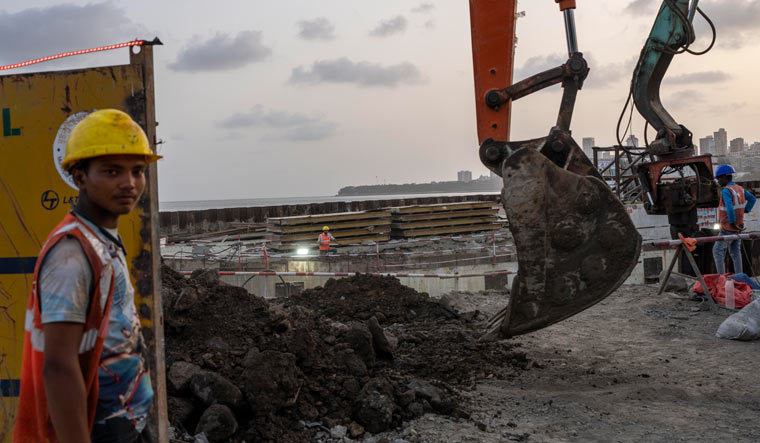 Workers are engaged in the construction of a coastal road in Mumbai | AP