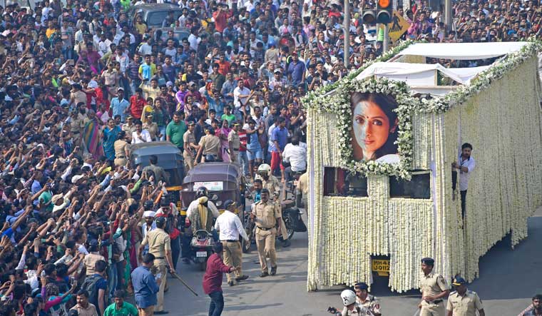 People take pictures and pay respect as Sridevi's body is carried in a truck during her funeral in Mumbai | Amey Mansabdar