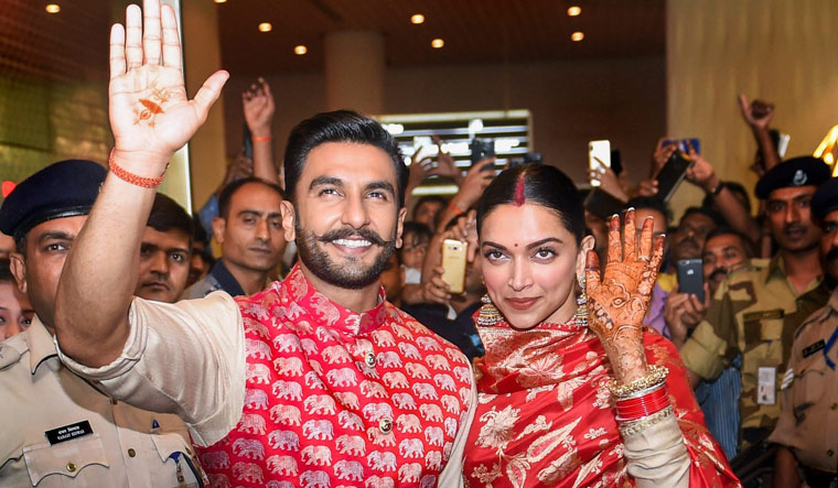Newlyweds Deepika, Ranveer arrive in India