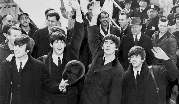 Unseen photos of The Beatles fetch 253,200 pounds at auction