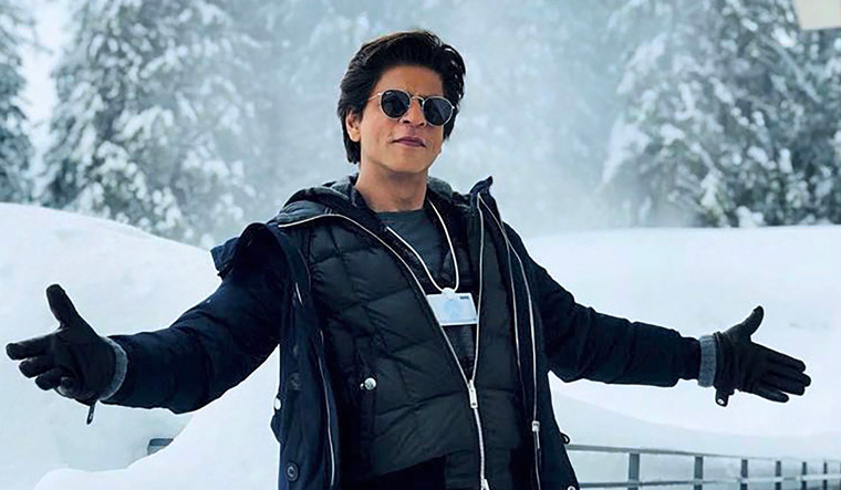 Sha Rukh Khan claims to be 'growing up very fast into a child'