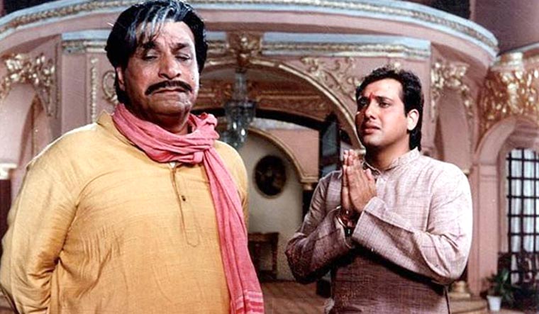 Kader Khan (left) and Govinda in a still from the film, Raja Babu