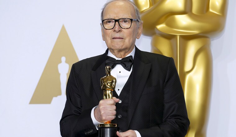 Ennio Morricone with his Oscar for best original score for 'The Hateful Eight' in 2016 | Reuters