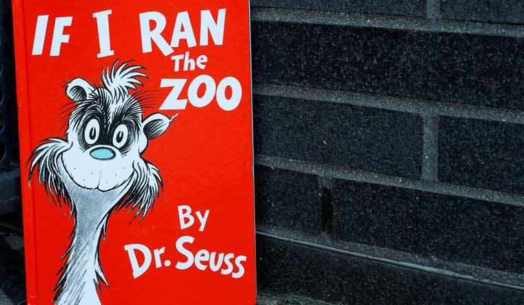 A copy of the children's book "If I Ran The Zoo" by author Dr. Seuss, which the publisher said will no longer be published, is seen in this photo illustration taken in Brooklyn, New York, U.S., March 2, 2021 | REUTERS/Brendan McDermid/Illustration 