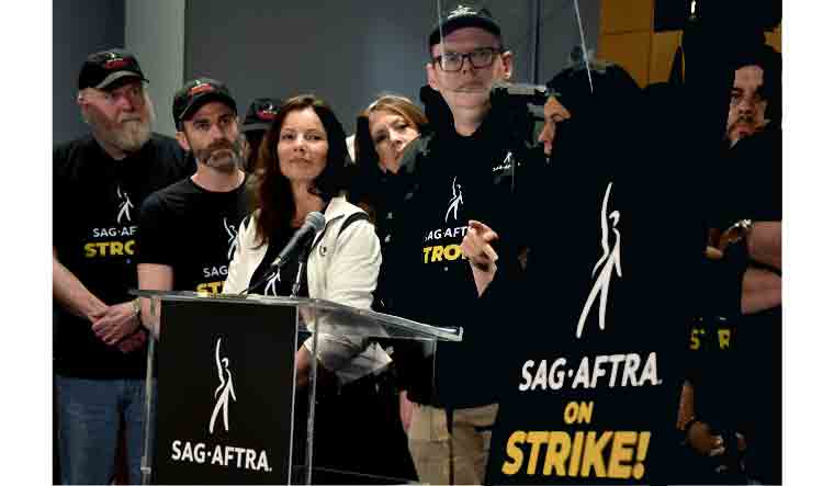 SAG-AFTRA President US actress Fran Drescher, SAG-AFTRA secretary-treasurer US actress Joely Fisher, and National Executive Director and Chief Negotiator Duncan Crabtree-Ireland, joined by SAG-AFTRA members, hold a press conference at the labor union's headquarters in Los Angeles | AFP