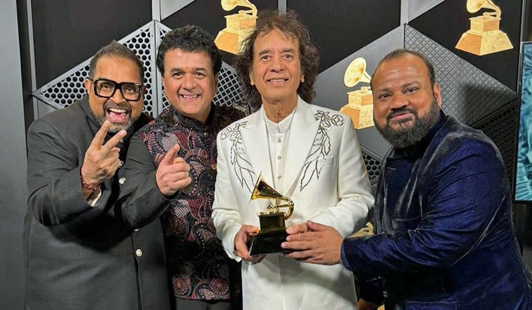 Ustad Zakir Hussain, vocalist Shankar Mahadevan, percussionist V Selvaganesh and violinist Ganesh Rajagopalan of Shakti pose for photos with the award for best global music album for 'This Moment' during the 66th annual Grammy Awards, in Los Angeles, USA, Sunday, Feb. 4, 2024 | PTI