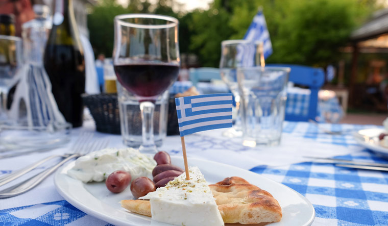 Greece-Greek-wine-food-tradition-Greek-Meze-with-Olives-Tzatziki-cheese-bread-shut