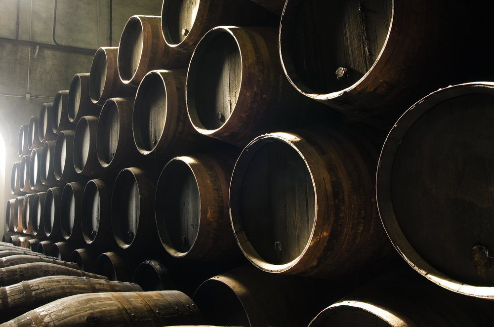 Barrels-for-whiskey-wine-stacked-in-cellar-shut