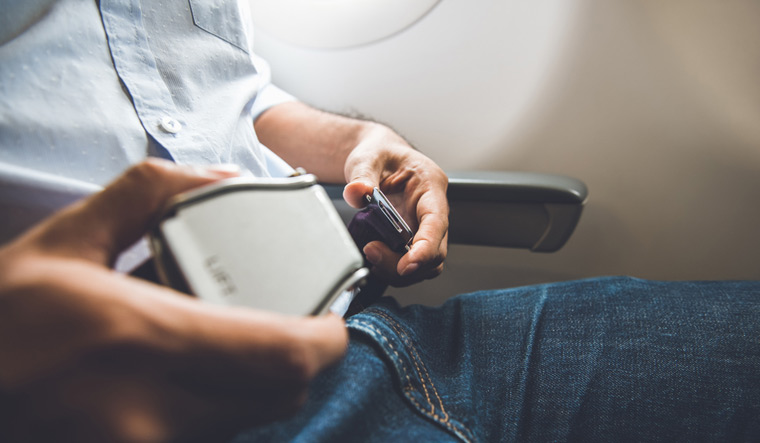 passenger-fastening-seat-belt-sitting-airplane-safe-flight-shut