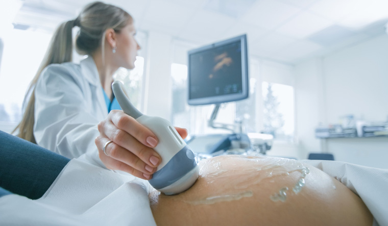 Ultrasound-Sonogram-Pregnant-Woman-Obstetrician-shut