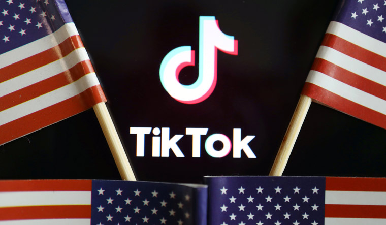 https://img.theweek.in/content/dam/week/news/health/images/2020/8/8/US-flags-are-seen-near-a-TikTok-logo-reu.jpg