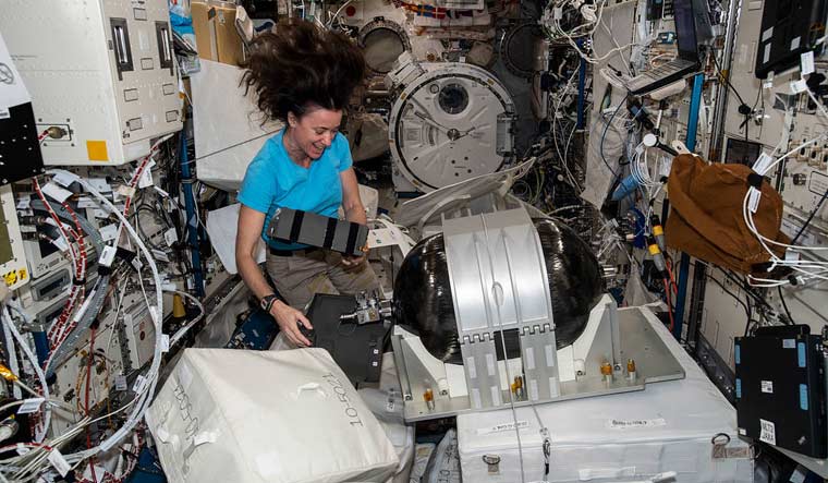 Astronaut-Megan-McArthur-assembles-an-Emergency-Air-Supply-tank-aug24-2021-nasa