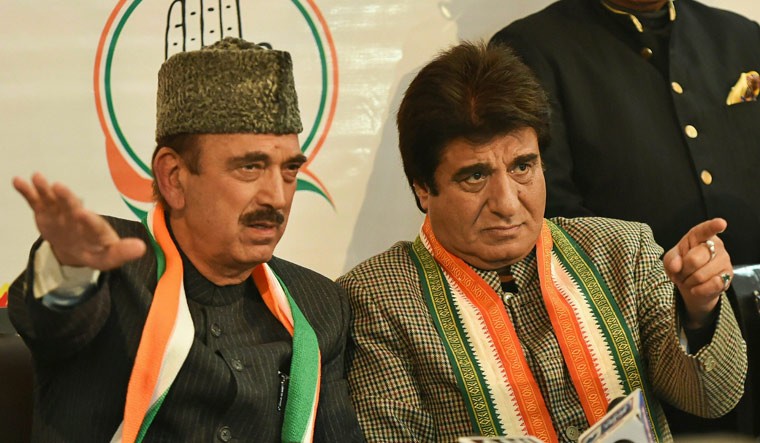 Senior Congress leader and party general secretary Ghulam Nabi Azad addresses a press conference in Lucknow as UP Congress chief Raj Babbar looks on | PTI