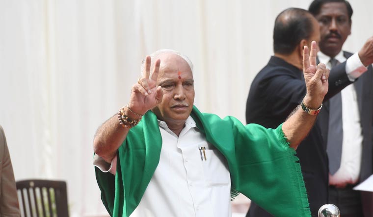 Yeddyurappa showing victory sign after taking oath as the chief minister | Bhanu Prakash Chandra