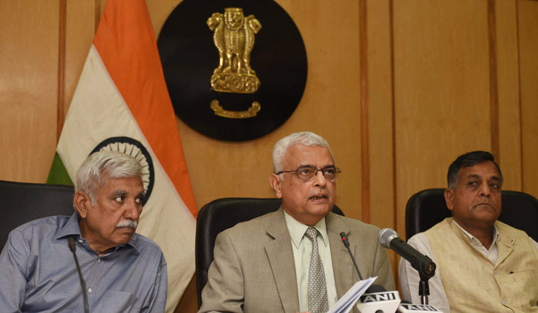 Chief Election Commissioner O.P. Rawat, with Election Commissioners Ashok Lavasa and Sunil Arora, announces the schedule for Karnataka elections at a press conference in New Delhi | PTI