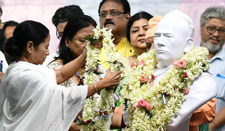 West Bengal Chief Minister Mamata Banerjee garlands a bust of Bengali reformer Ishwar Chandra Vidyasagar after its installation at a college where an old one was vandalised during a roadshow of then BJP president Amit Shah last month | Salil Bera