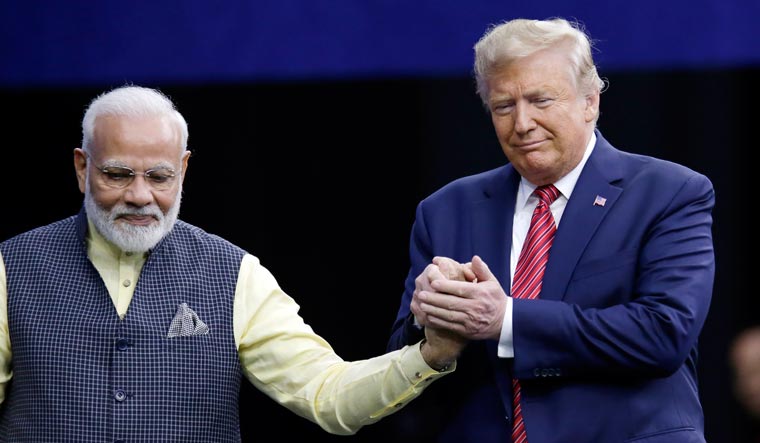 Prime Minister Narendra Modi and President Donald Trump shake hands after introductions during the 