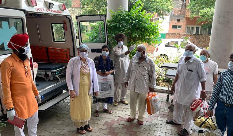 COVID-19 patients being discharged from a hospital in Jalandhar | Aayush Goel