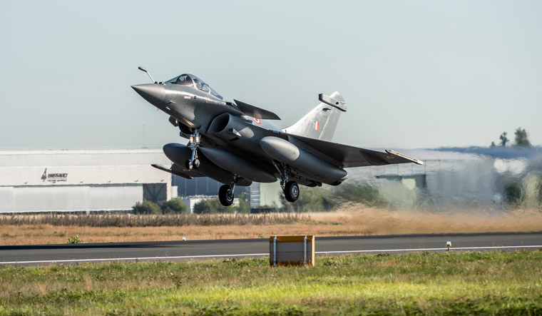 A handout picture taken and released by Dassault Aviation shows an Indian Air Force Rafale aircraft taking off from Merignac air base | AFP
