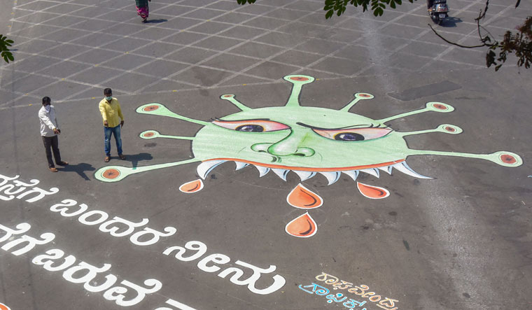 [File] A coronavirus graffiti drawn at a junction to create awareness during a nationwide lockdown imposed in the wake of the pandemic, in Bengaluru | PTI
