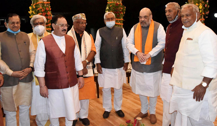 Union Home Minister Amit Shah and BJP national president J.P. Nadda with Bihar Chief Minister Nitish Kumar and Deputy Chief Ministers Renu Devi and Tarkishore Prasad after the oath-taking ceremony at Raj Bhawan in Patna | PTI