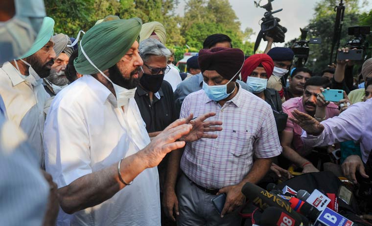 Captain Amarinder Singh speaks to media after submitting his resignation to Governor Purohit Banwarilal at Raj Bhavan in Chandigarh | PTI