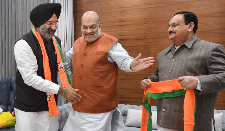Manjinder Singh Sirsa with Union Home Minister Amit Shah and BJP president J.P. Nadda at party headquarters in Delhi | PTI
