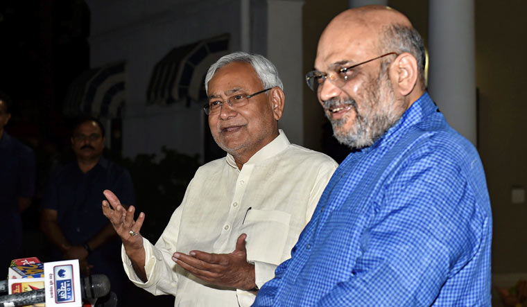 BJP president Amit Shah and Bihar Chief Minister Nitish Kumar interact with the media at the former's residence in New Delhi on Friday | PTI