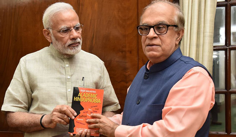 Malhotra with Modi