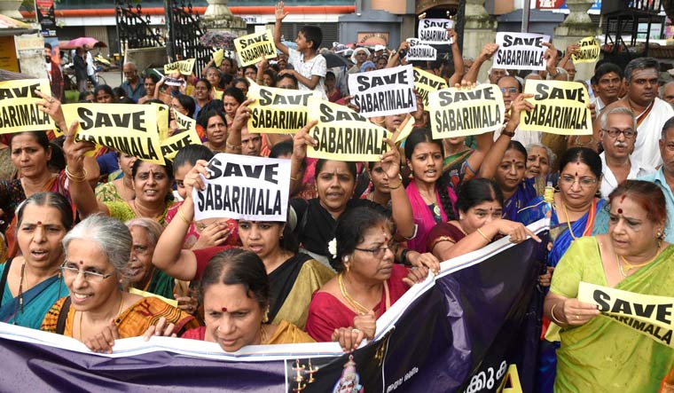 Devotees, mostly women, take part in the 'namajapa' (chanting the name of Lord Ayyappa ) in Ernakulam, Sunday, Oct 09, 2018 against the Supreme Court verdict on the entry of women of all ages into the Sabarimala Lord Ayyappa Temple | PTI