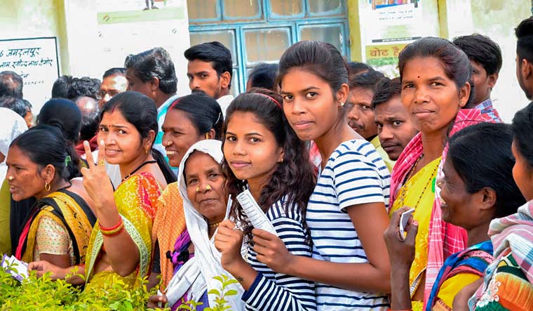 [File] People wait in queues to cast their votes at a polling station at Mangnar in Naxal-affected Bastar district during the first phase of Assembly elections in Chhattisgarh on November 12 | PTI