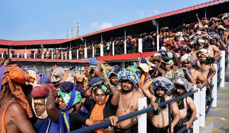 Devotees queue up to offer prayers at Lord Ayyappa temple in Sabarimala | PTI