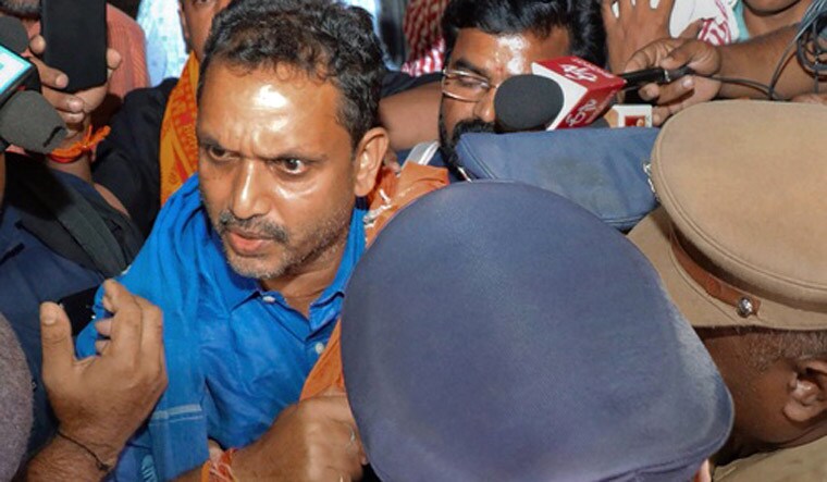 BJP's Kerala state general secretary K Surendran being taken into preventive detention near Sabarimala by the state police when he came to visit Sabarimala | PTI