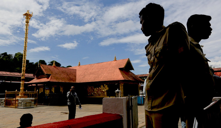 Policemen stand guard at the Sabarimala temple | AP