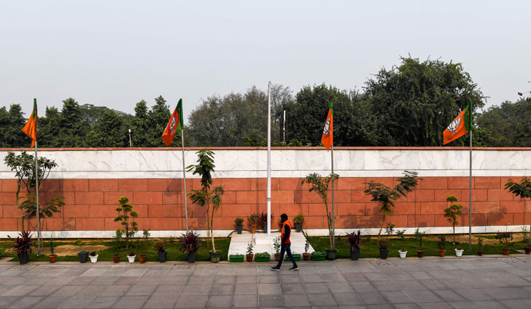 A BJP member walks inside the deserted party's headquarters in New Delhi on Tuesday | AFP