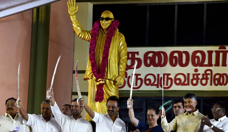 Kerala Chief Minister Pinarayi Vijayan (left), Congress chief Rahul Gandhi, DMK chief M.K. Stalin, Sonia Gandhi and Andhra Pradesh Chief Minister Chandrababu Naidu brandish ceremonial swords at the unveiling of a statue of late DMK leader M. Karunanidhi | PTI