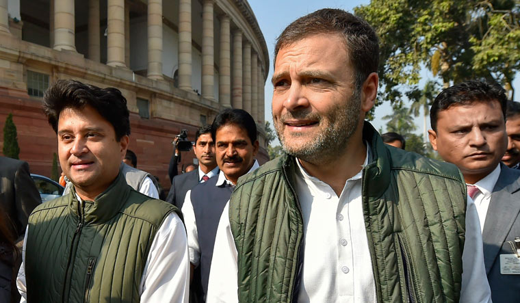 Congress president Rahul Gandhi with party MP Jyotiraditya Scindia arrives to address the media during the Winter Session of Parliament | PTI