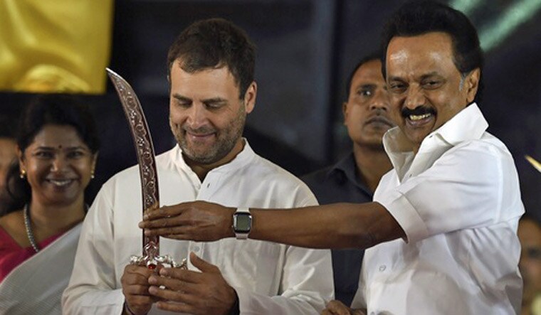 Congress President Rahul Gandhi is being presented a sword by DMK president MK Stalin at a public meeting after unveiling a life-size bronze statue of late Chief Minister and DMK President M Karunanidhi at YMCA ground, in Chennai | PTI