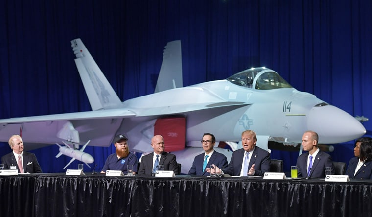 US President Donald Trump sitting in front of a Super Hornet fighter on a visit to the Boeing Company in St. Louis, Missouri | AFP