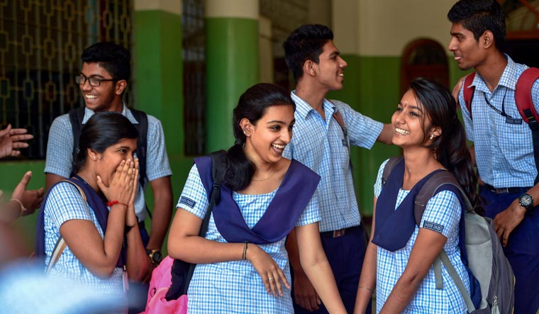 Students appearing for CBSE's class 12 Biology board paper in a light mood at an examination centre in Chennai on Tuesday  | PTI