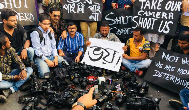 Photojournalists and journalists during a protest against the assault of a lensman by TMC supporters, in Kolkata | Salil Bera