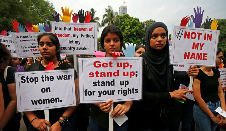 People participate in a protest against increasing number of rape incidents in the country in Kolkata | Reuters