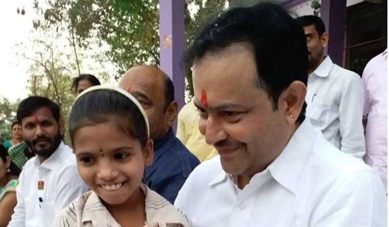 Bhaiyyu Maharaj with a young follower | Bhaiyyu Maharaj's Facebook account