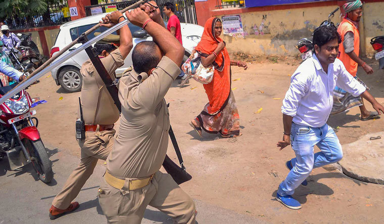 Police conduct a lathi charge during the Bharat bandh in Varanasi | PTI